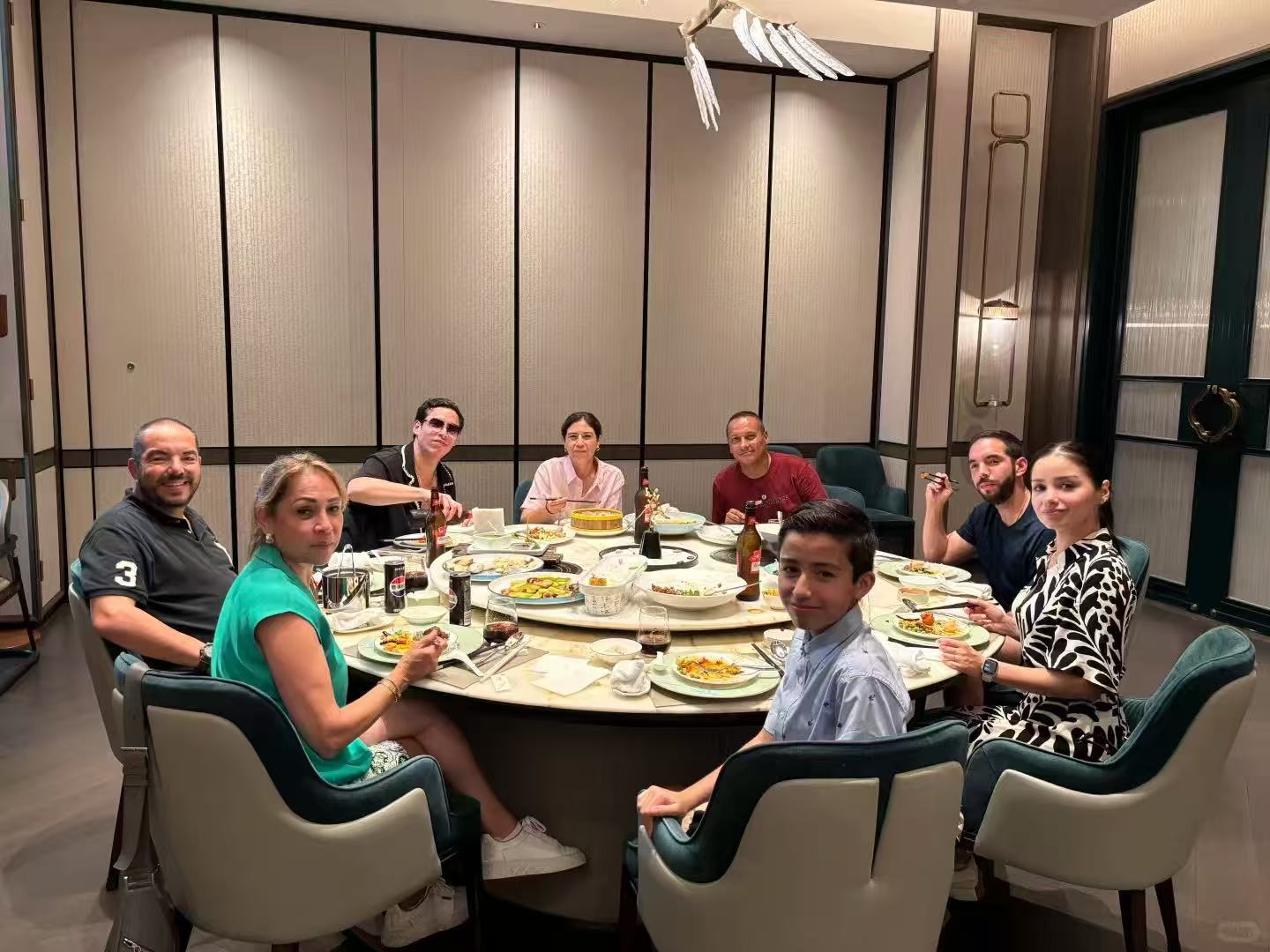 Travel group enjoying a Chinese round-table dinner together