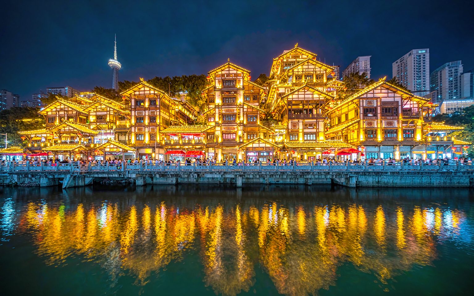 Hongya Cave stilted buildings glowing at night, Chongqing